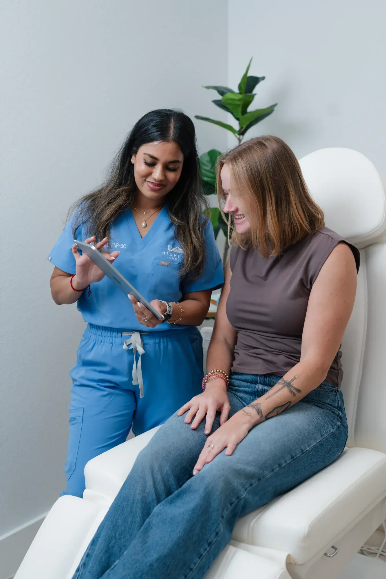 Divya, NP consulting with patient at Highland Longevity Fort Worth